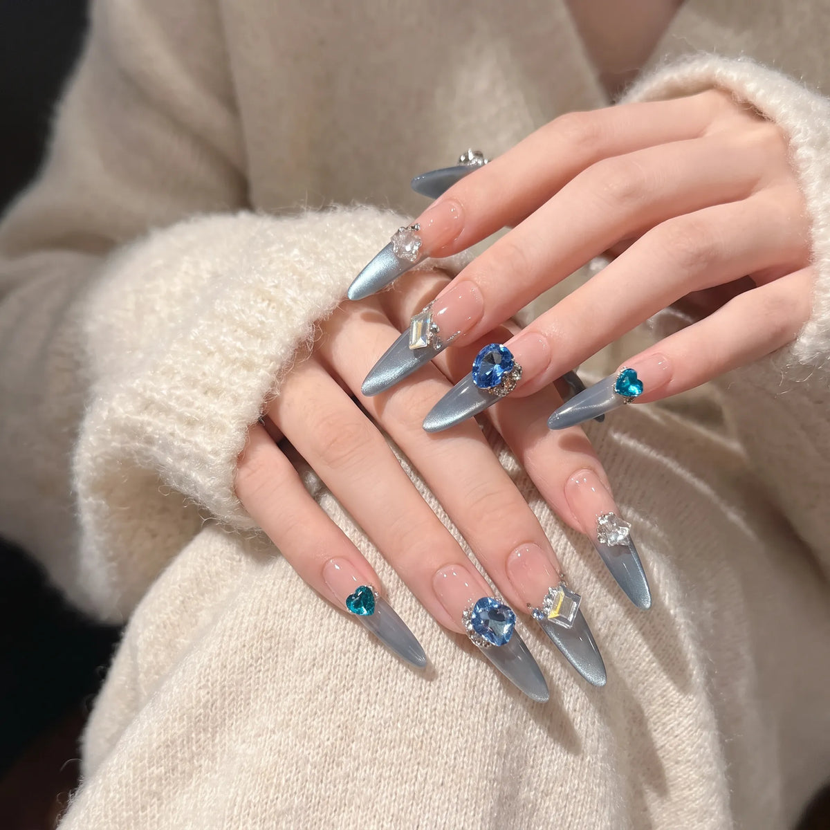 Blue Danube press-on nails side view highlighting holographic crystal cubes and magnetic shimmer
