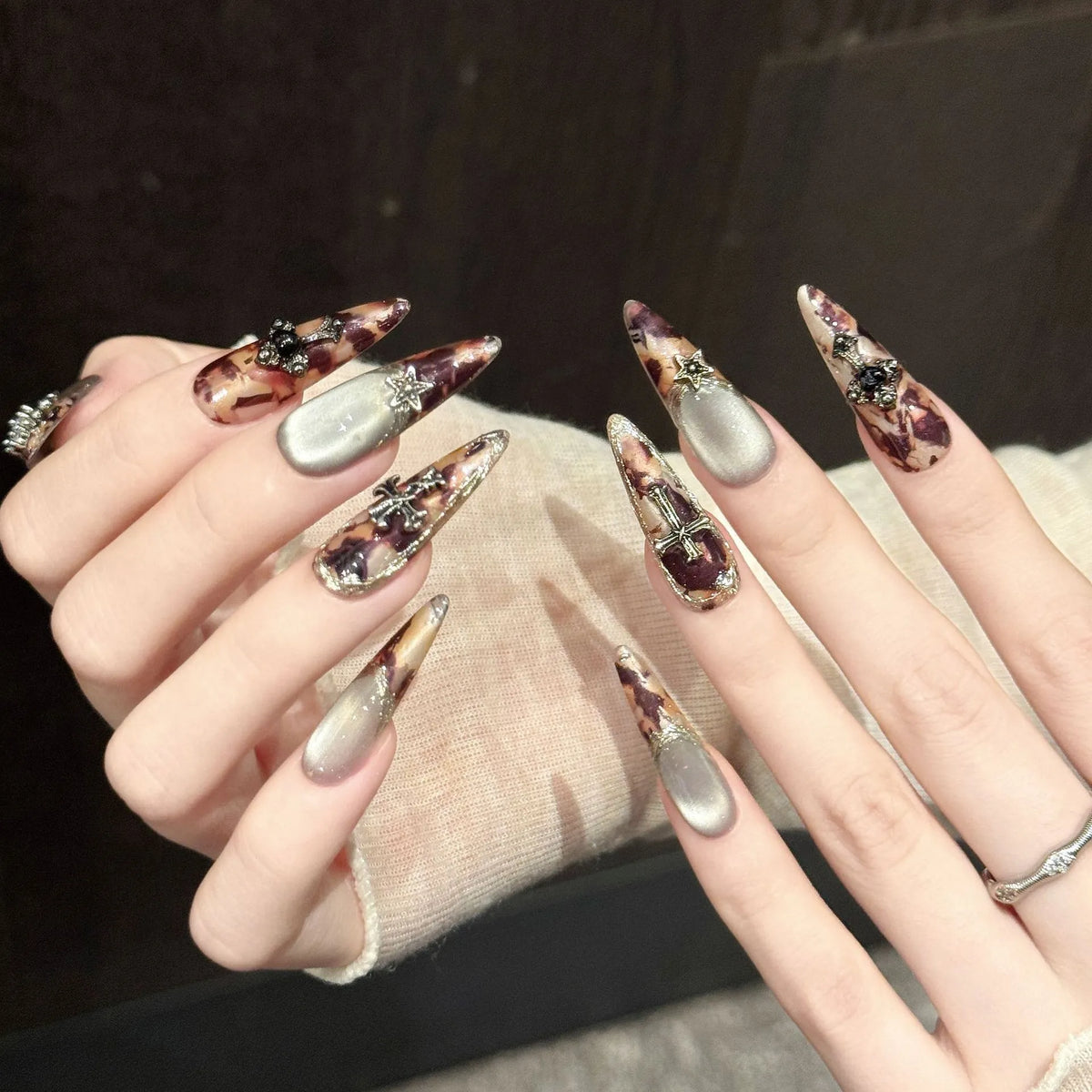 Close-up detail of Antique Relic cat-eye magnetic effect, silver metallic accents, and antique cameo embellishments