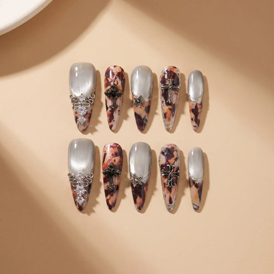 Antique Relic 10-piece handmade press-on nail set with cat-eye shimmer and vintage designs - product flat lay