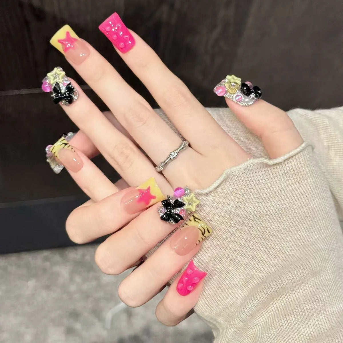 Close-up detail of Black Butterfly star motifs, color-block contrast, and glossy matte finishes 🖤✨