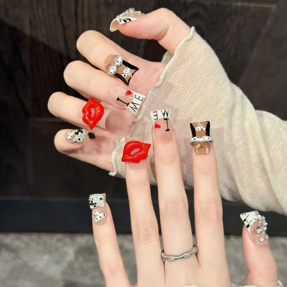 Blazing Kiss duck nails angled view showing red and black palette, bold lip graphics 🔥