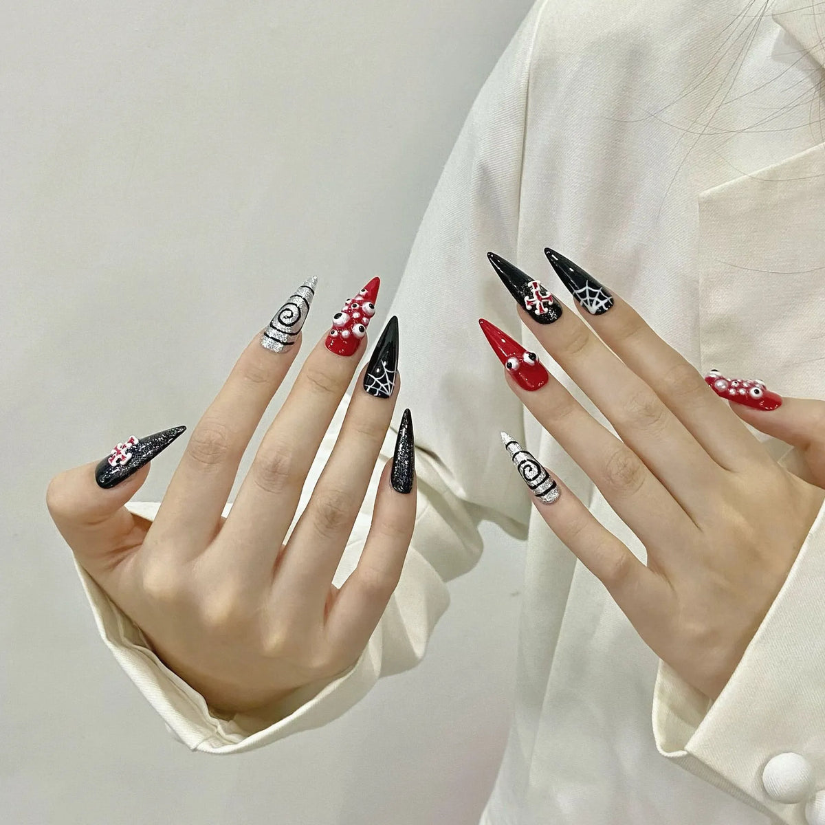 Angled view of Y2K gothic long stiletto nails with 3D elements ✨