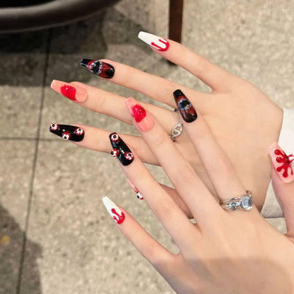 Bloody Eyeball medium coffin press-on nails worn on hands with red and black Halloween details