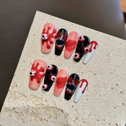 Bloody Eyeball 2365 medium coffin press-on nail set with raised eyes, red drips and black face art