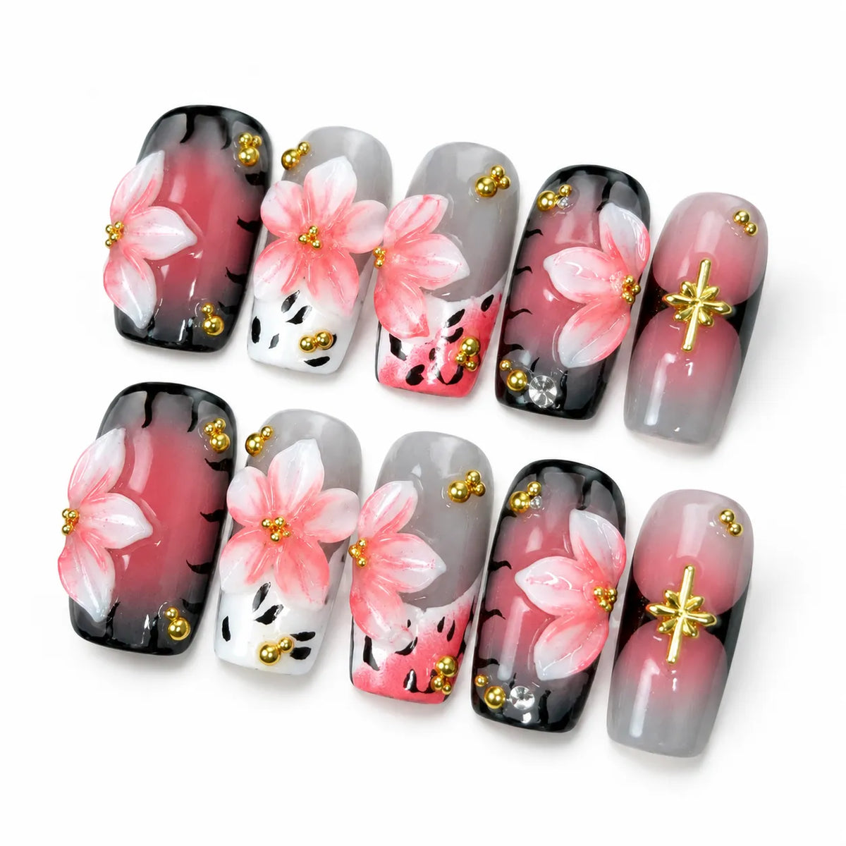 Angled view of pink black and gray Medium Coffin nails with 3D flowers, gold beads, and crystal accents
