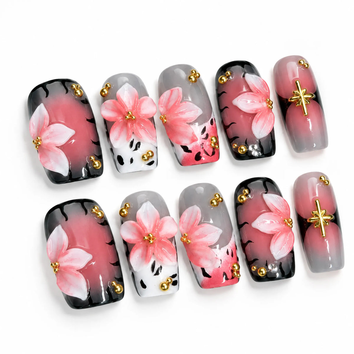 Flat lay of Blush Noir Sakura Medium Coffin nails with raised cherry blossoms and hand-painted details