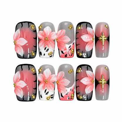 Blush Noir Sakura NM-C262 Medium Coffin press-on nail set with pink flowers, black gradients, and gold beads