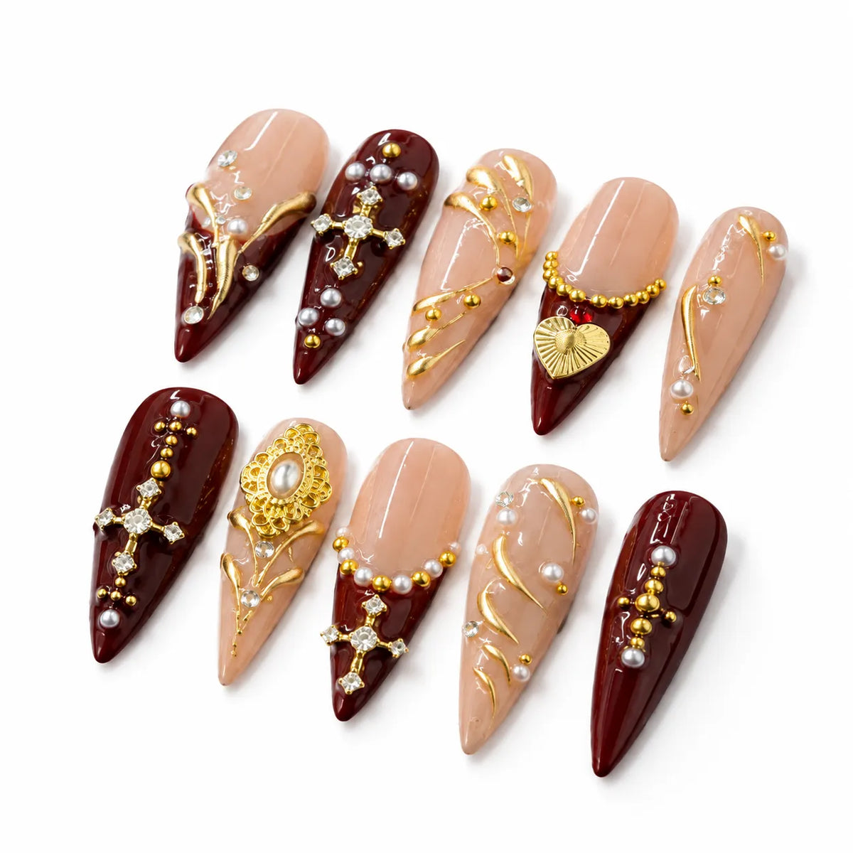 Detailed view of NM-Z220 Long Stiletto nails with a sacred heart gold filigree and botanical lines