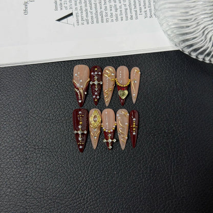 Additional lifestyle view of Burgundy Reliquary cross pearl and gold Long Stiletto nails