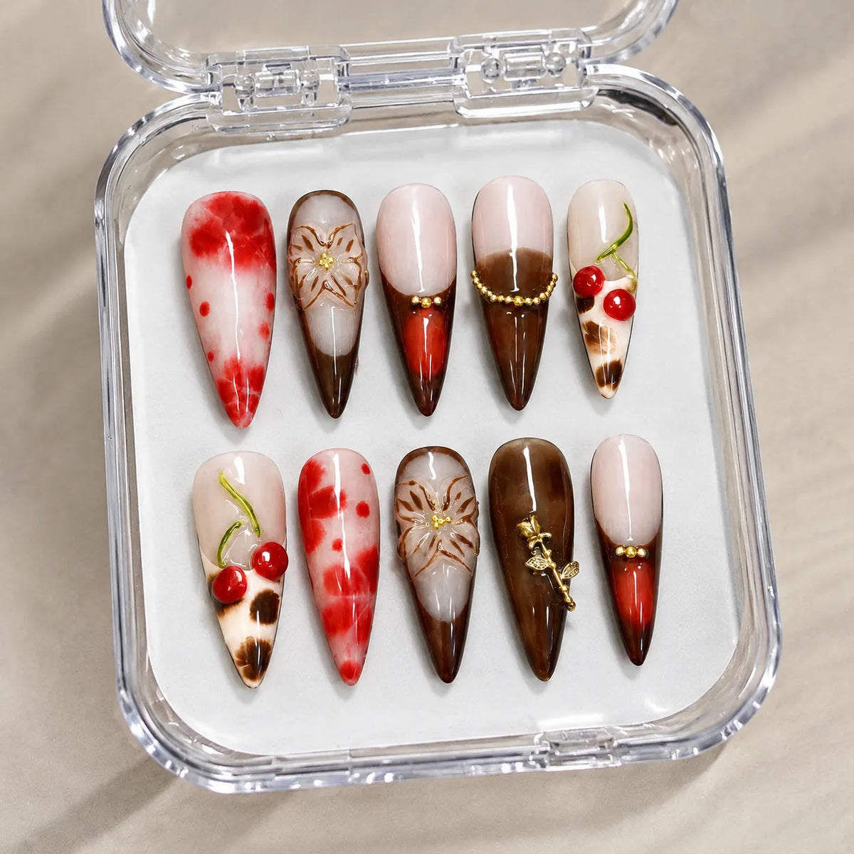 Cherry Mocha Bloom NM-C017 handmade nail set arranged in a clear presentation case