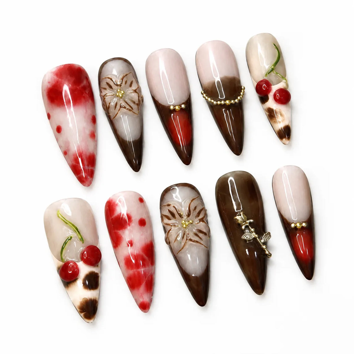 Cherry Mocha Bloom Long Stiletto nail set on white showing cherries, mocha tips, flowers, and crystal trim
