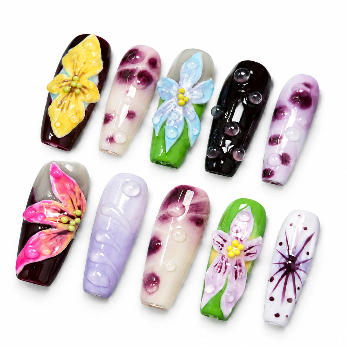 Angled view of colorful Medium Coffin nails with sculpted orchid petals translucent ombre and bubble details