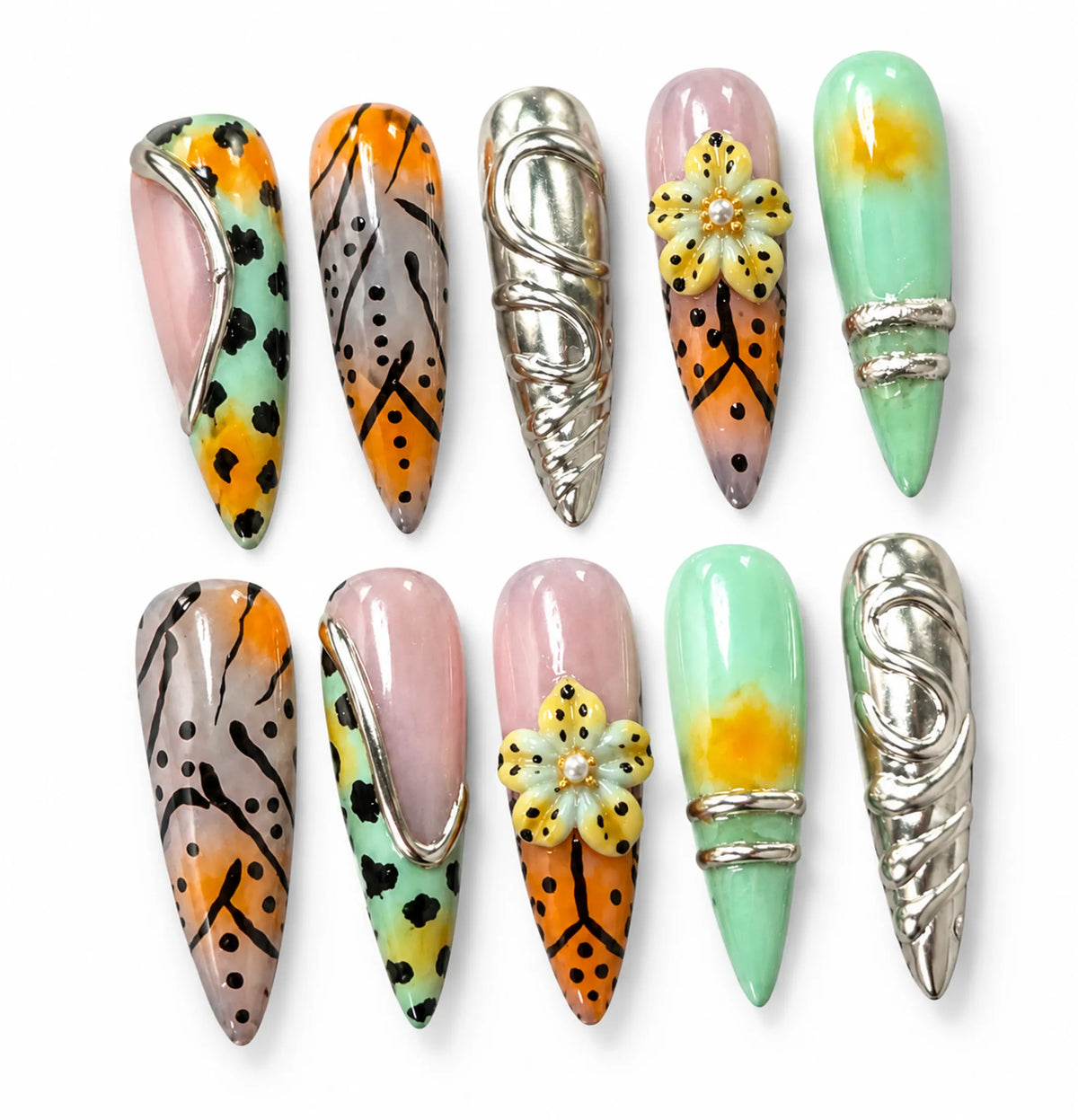 Angled view of mint orange and nude Long Stiletto nails with black animal spots and chrome accents