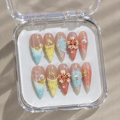 Coastal Bloom NM-C106 nail set in a clear case under natural light