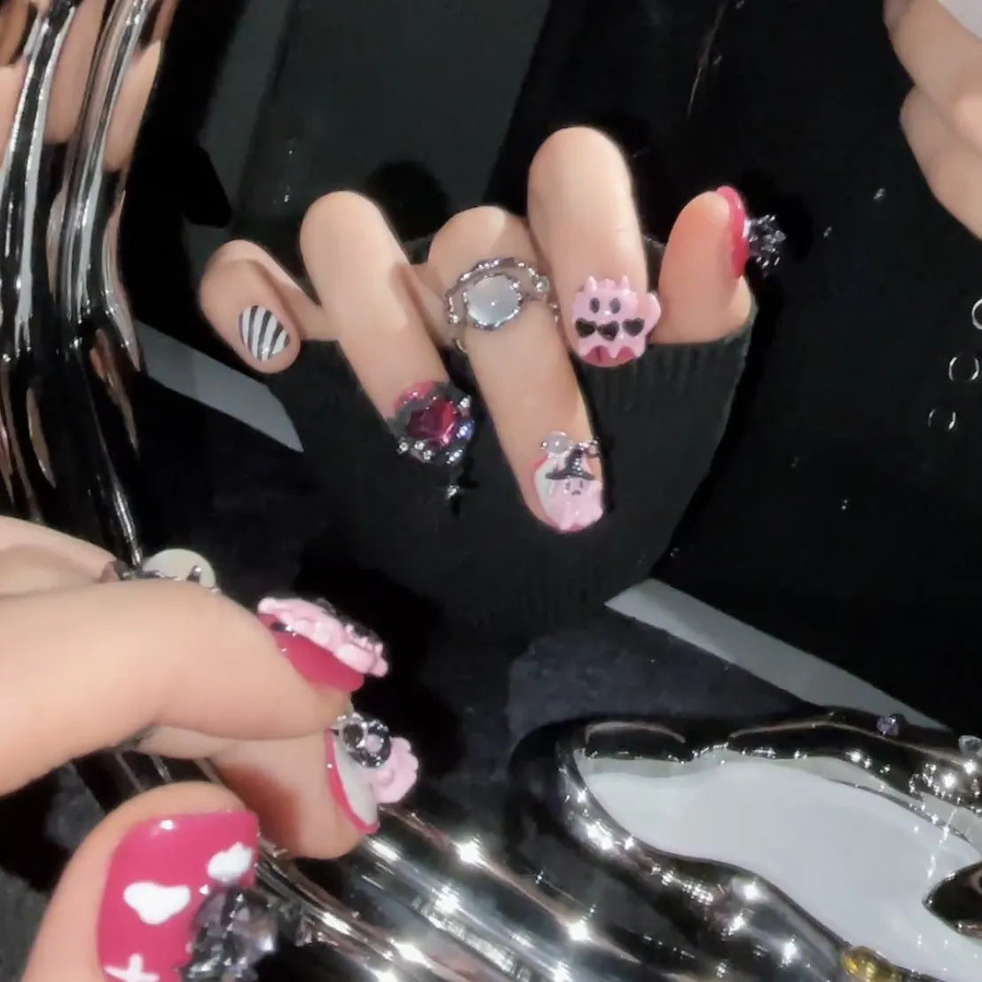 Devil Heart short oval nails close-up showing pink and black gothic details