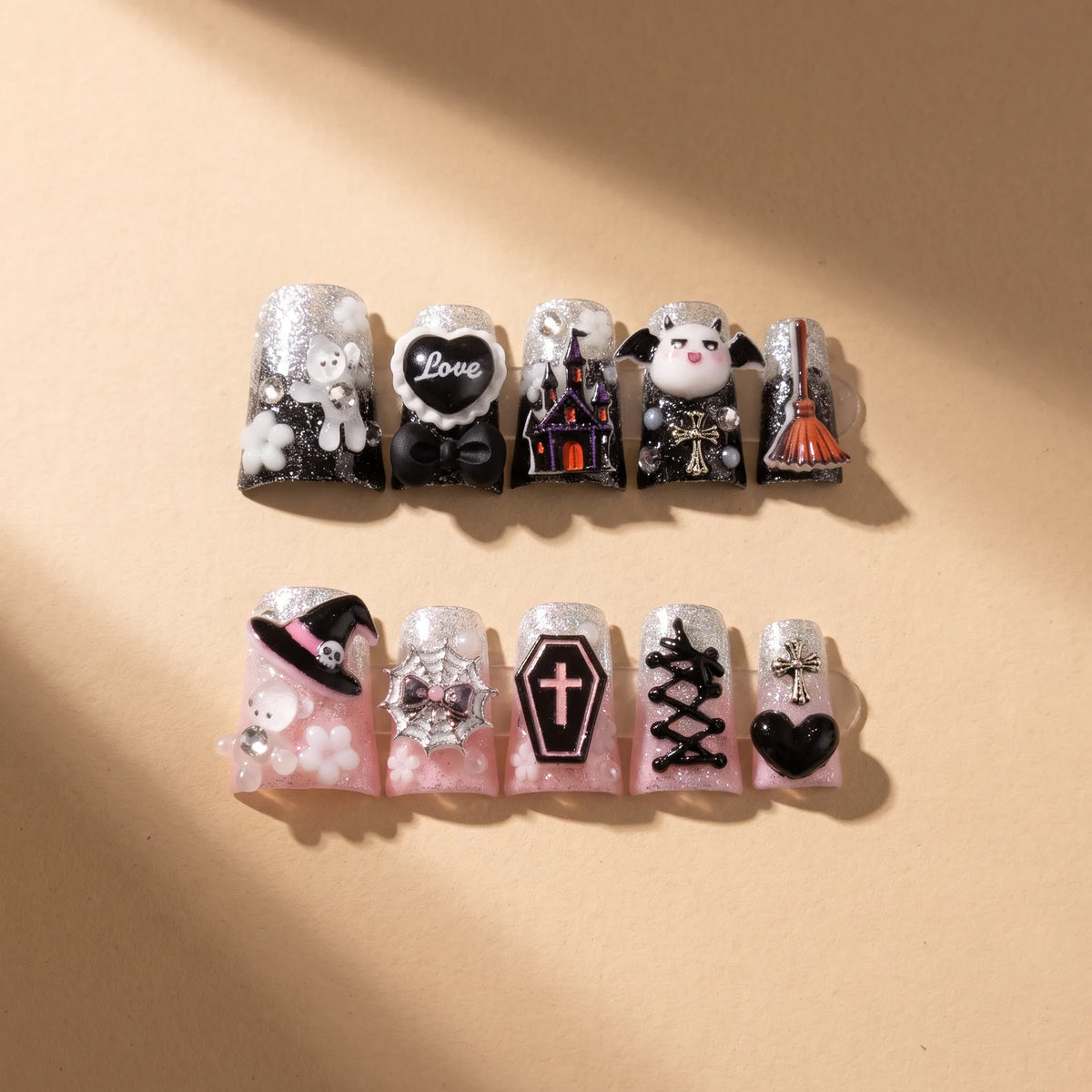 Devil Night 10-piece handmade press-on nail set with AB black pink gothic designs - product flat lay 😈