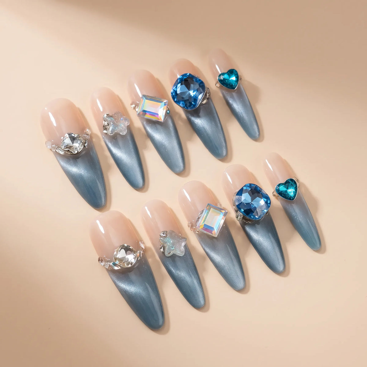 Blue Danube stiletto nails angled view showing ice blue gradient and sapphire gemstone details