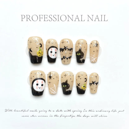 Faceless Pumpkin short coffin press-on nails with quirky character and pumpkin design on hand - lifestyle shot 🎃👻