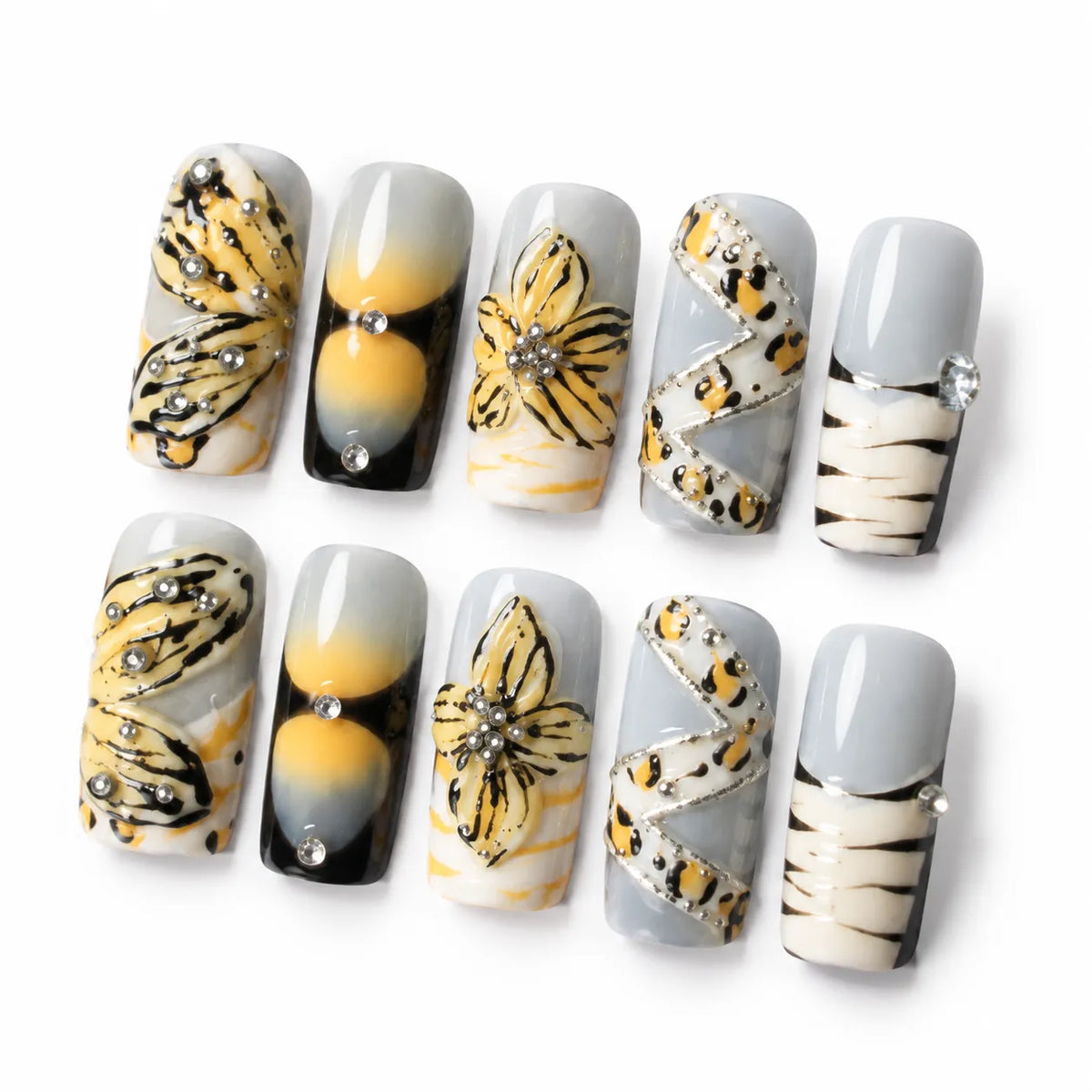 Detailed view of NM-A030 Medium Coffin nails with hand-painted black lines ombre and crystal accents