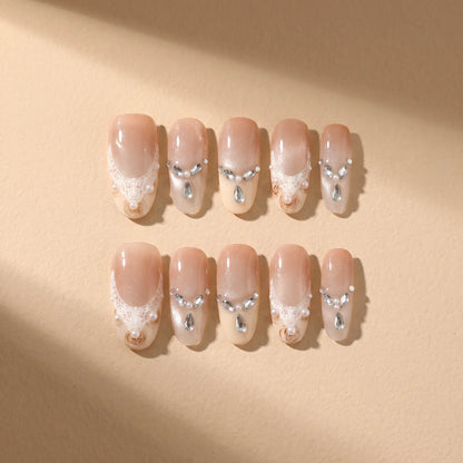 Golden Elegance 10-piece handmade press-on nail set with lace and pearl designs - product flat lay 💛