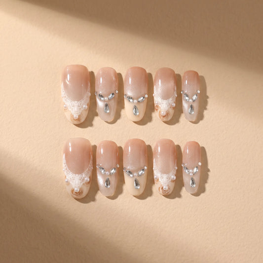 Golden Elegance 10-piece handmade press-on nail set with lace and pearl designs - product flat lay 💛