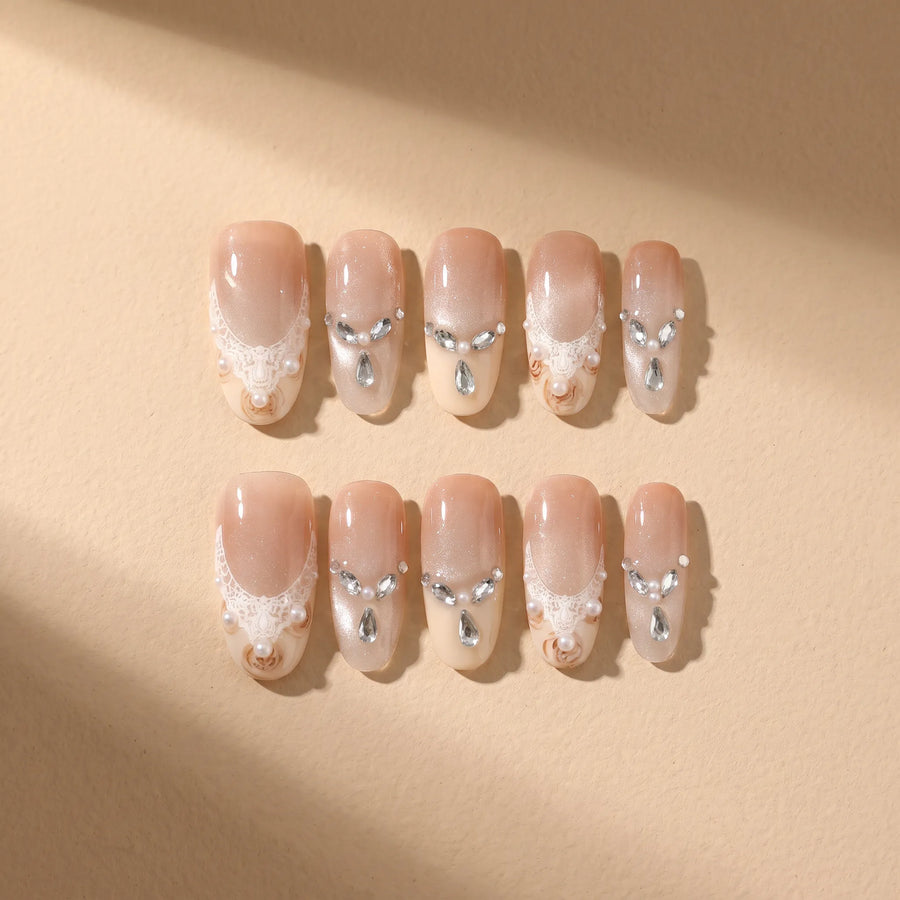 Golden Elegance 10-piece handmade press-on nail set with lace and pearl designs - product flat lay 💛
