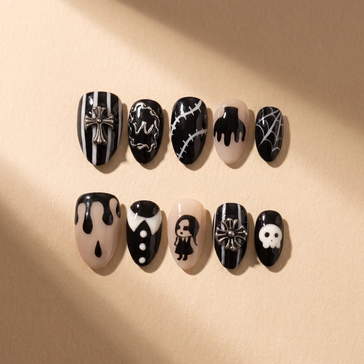 Gothic Shadow 10-piece handmade press-on nail set with 3D cross, skull, and gothic designs - product flat lay 💀