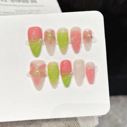 Green Grape almond press-on nails with sweet gradient 3D flower soft feminine design on hand - lifestyle shot 🍇💚