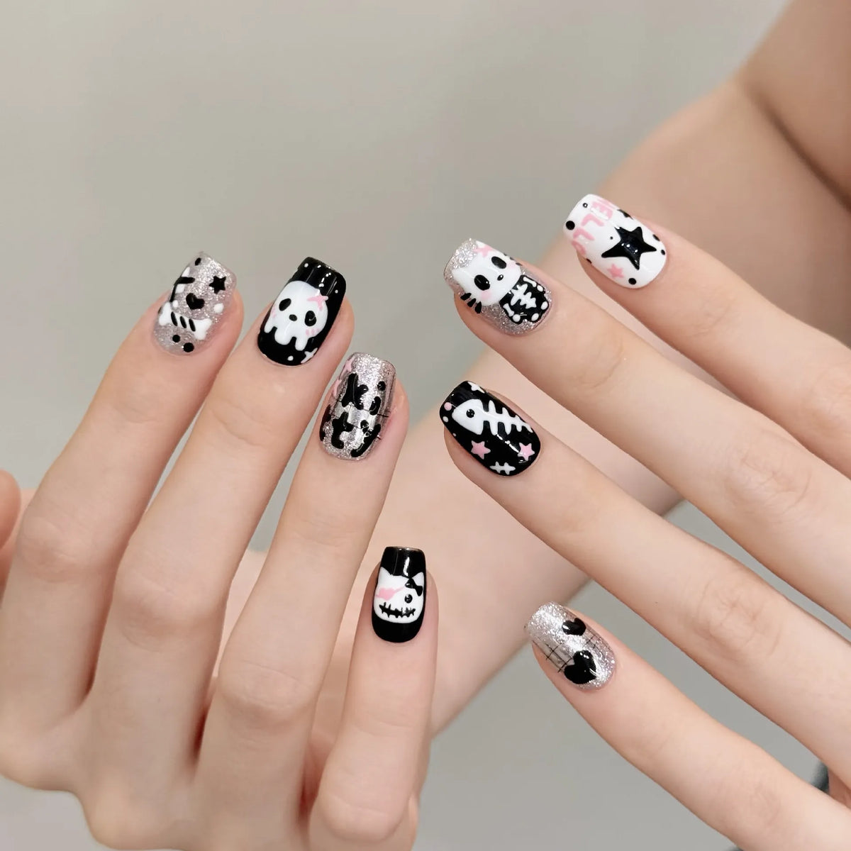 Halloween cat ghost short square press-on nails 3109 shown in a lifestyle hand view