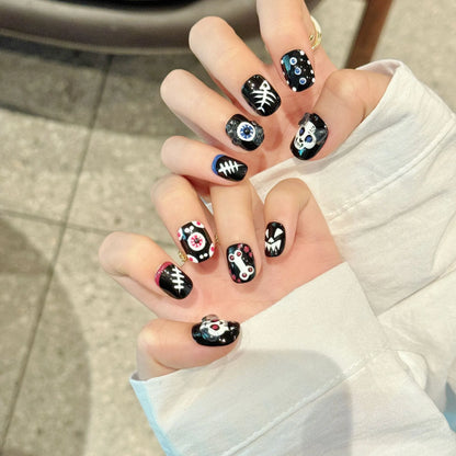 Halloween Pumpkin Skull short oval nails angled view showing gothic Halloween design elements 🎃💀✨