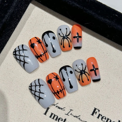 Halloween Stitch Spider short coffin press-on nail set with orange gray gradients, webs and black spiders