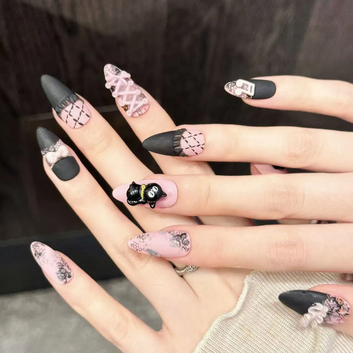 Close-up detail of Honey Cat black cat silhouettes, music notes, lace patterns, and bow ribbons 🎵💗