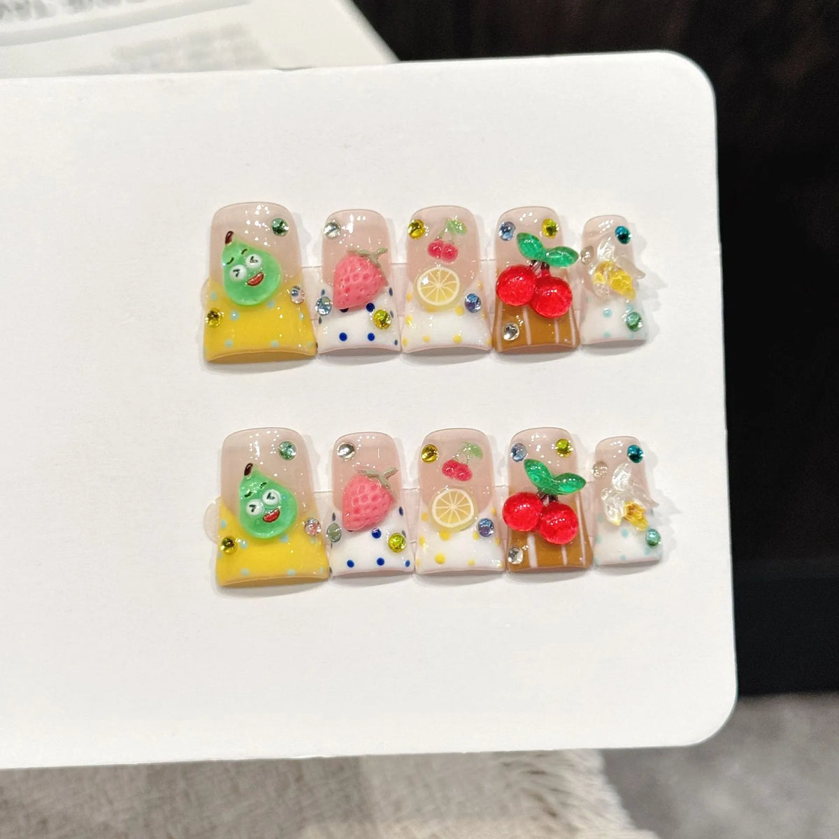 Lemon Fruit short duck press-on nails with cute fruit vibrant sweet girl design on hand - lifestyle shot 🍋🍓