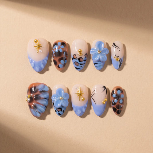 Leopard Lagoon 10-piece handmade press-on nail set with blue floral and leopard print designs - product flat lay