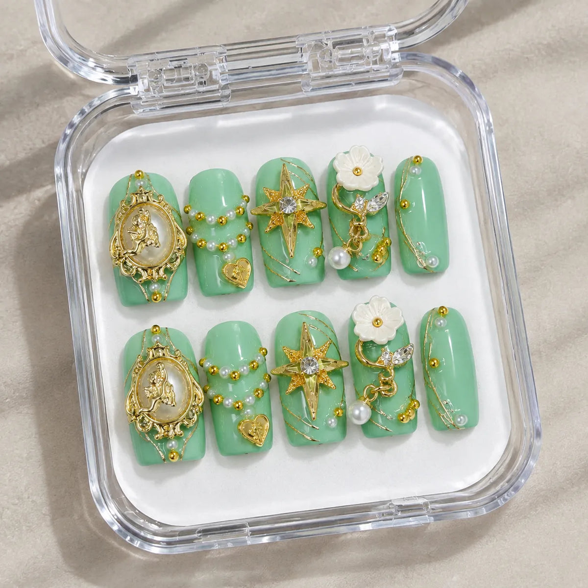 Mint Celestial Cameo handmade Medium Coffin nail set arranged in a clear presentation case