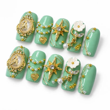 Detailed view of NM-C126 Medium Coffin nails with heart locks white flowers and dangling pearl charms