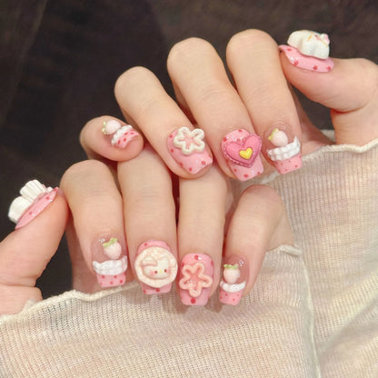 Pink Star Kitty square nails angled view showing 3D cartoon cats, stars, and kawaii art