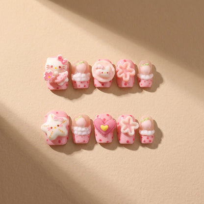 Pink Star Kitty 10-piece handmade press-on nail set with 3D cat and kawaii designs - product flat lay