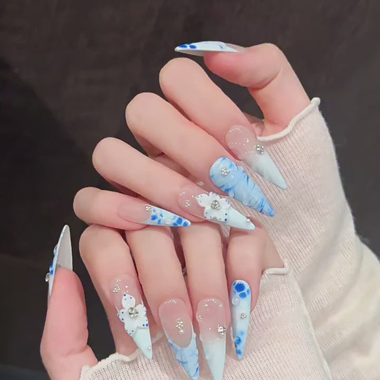 Porcelain Tide press-on nails with blue gradient floral and water ripple designs - 360 degree product video showcase