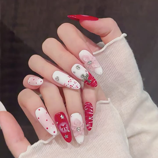 Scarlet Ritual press-on nails with red bow and Christmas designs - 360 degree product video showcase