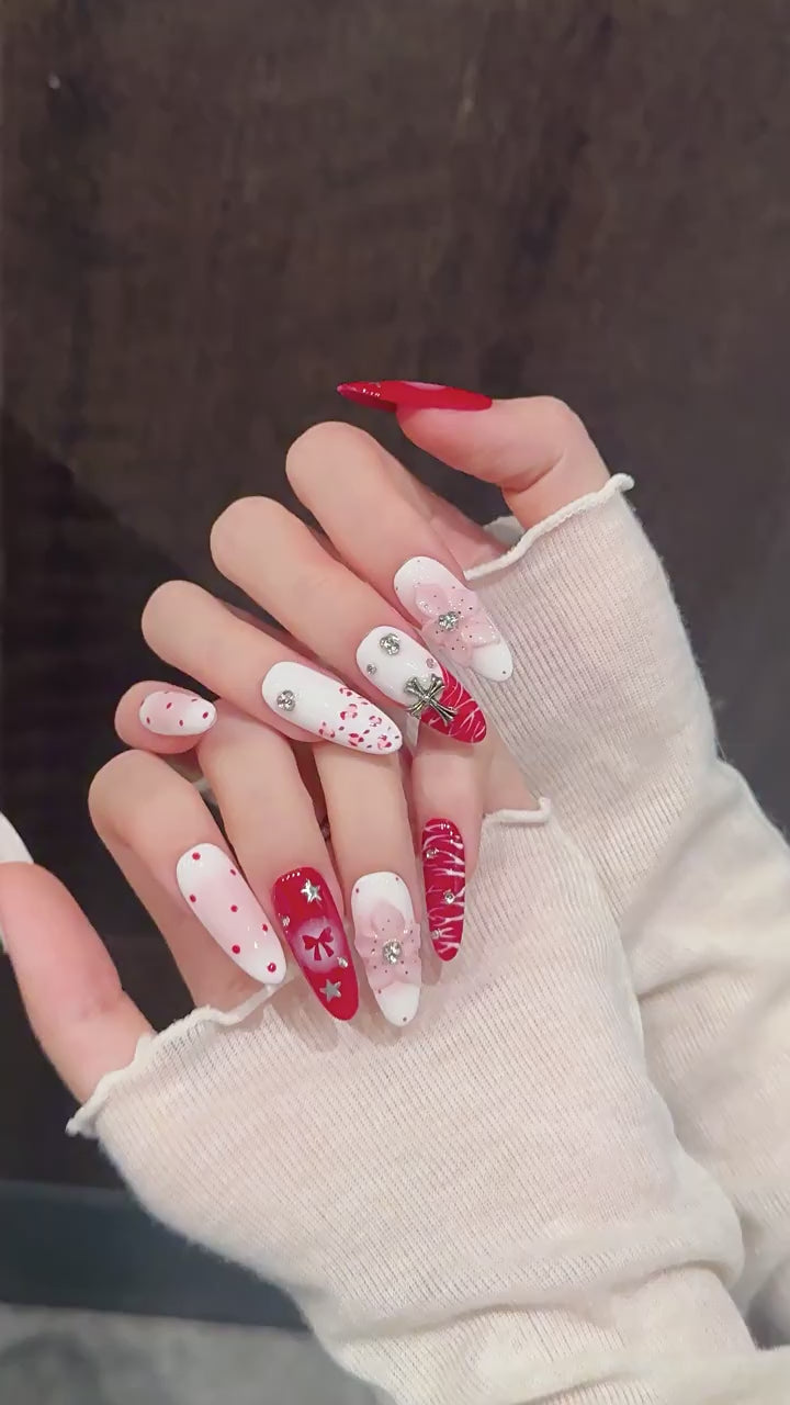 Scarlet Ritual press-on nails with red bow and Christmas designs - 360 degree product video showcase