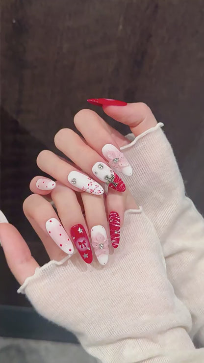 Scarlet Ritual press-on nails with red bow and Christmas designs - 360 degree product video showcase
