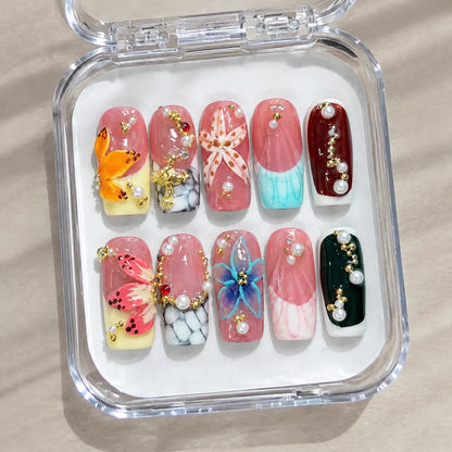 Prism Garden Opulence handmade Medium Coffin nail set arranged in a clear presentation case