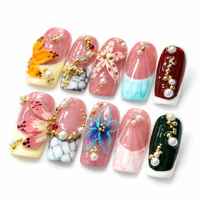 Detailed view of NM-A014 Medium Coffin nails with pearl clusters marble veining and crystal jewelry