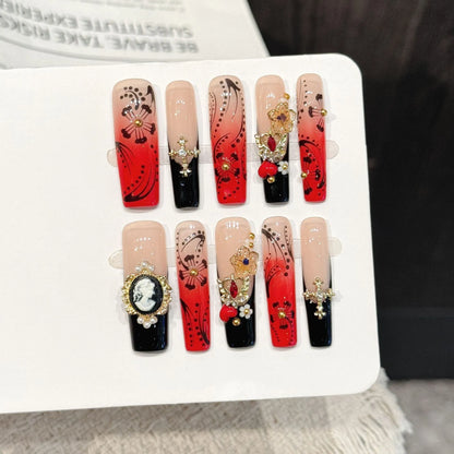 Red Ink Floral long square press-on nails with vintage red black gradient hand-painted design on hand - lifestyle shot 🌹🖤