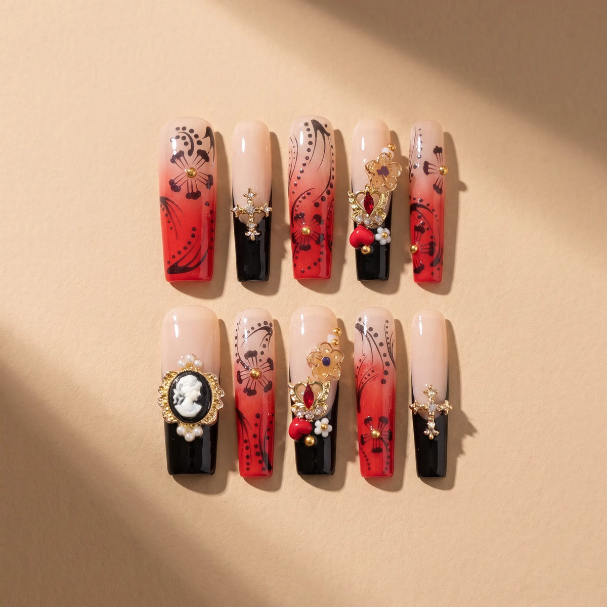 Red Ink Floral 10-piece handmade press-on nail set with gradient and floral designs - product flat lay 🌹