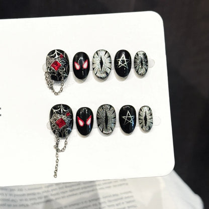 Red Spider Night long stiletto press-on nails with spider web, chains, and glitter gothic design on hand - lifestyle shot 🕷️⛓️