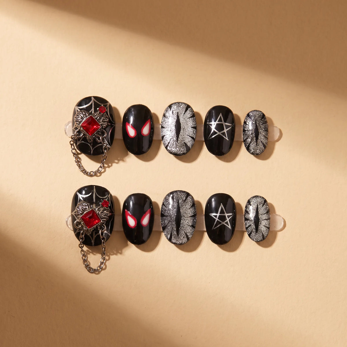 Red Spider Night 10-piece handmade press-on nail set with spider web, chains, and gothic designs - product flat lay 🕷️
