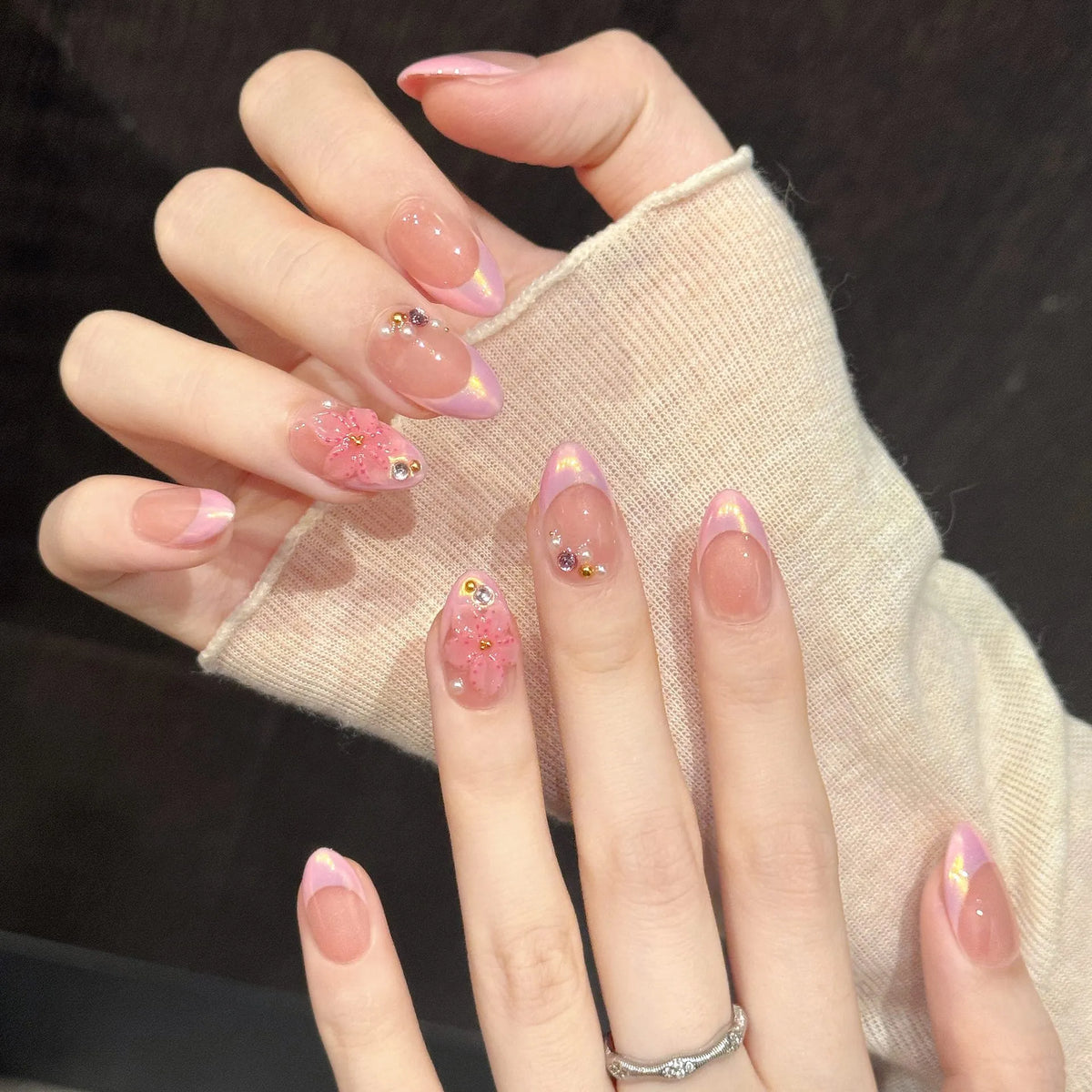 Rose Quartz Glow oval nails angled view showing nude pink gradient, chrome shimmer, and aurora reflections