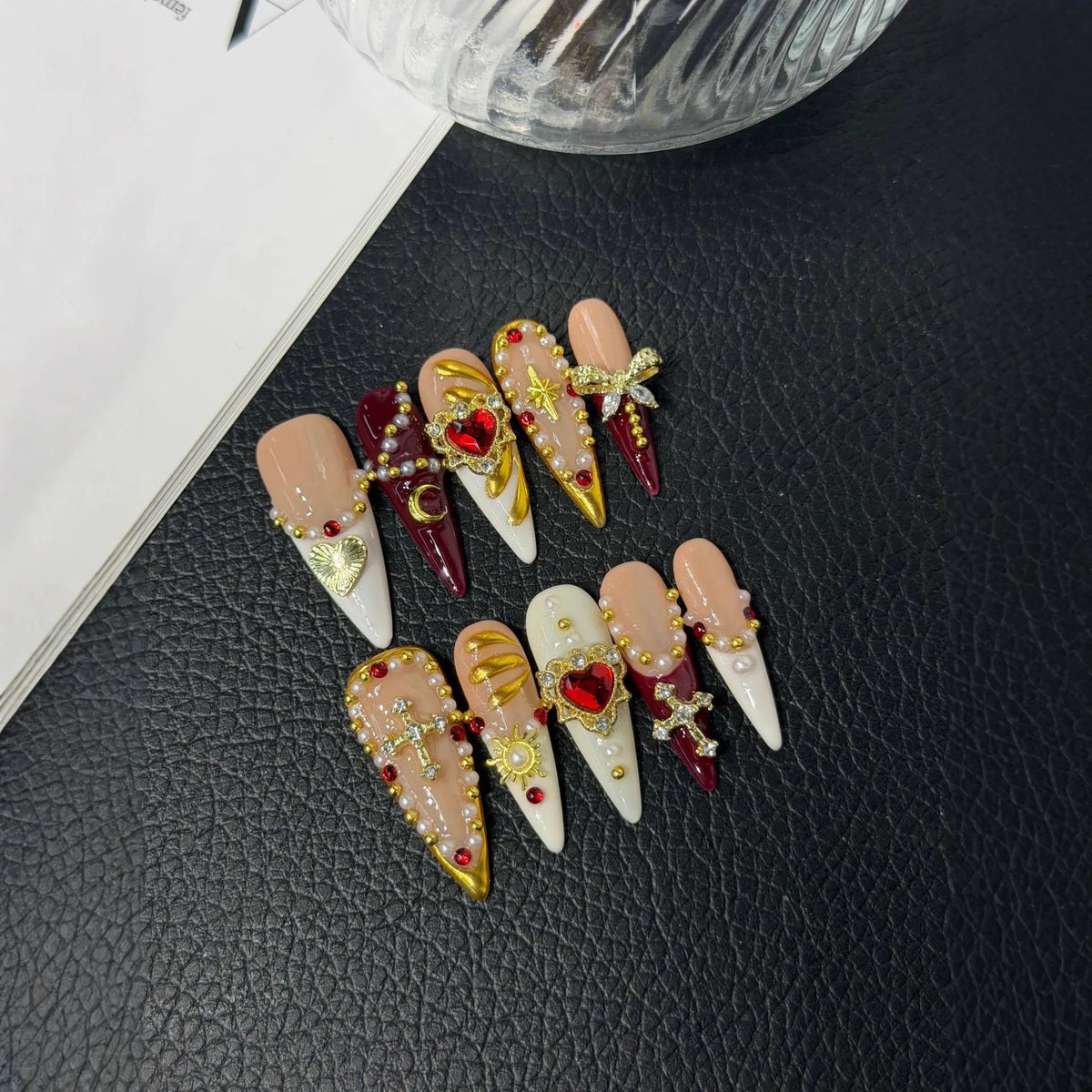 Additional lifestyle view of Sacred Garnet Heart cross and pearl Long Stiletto nails